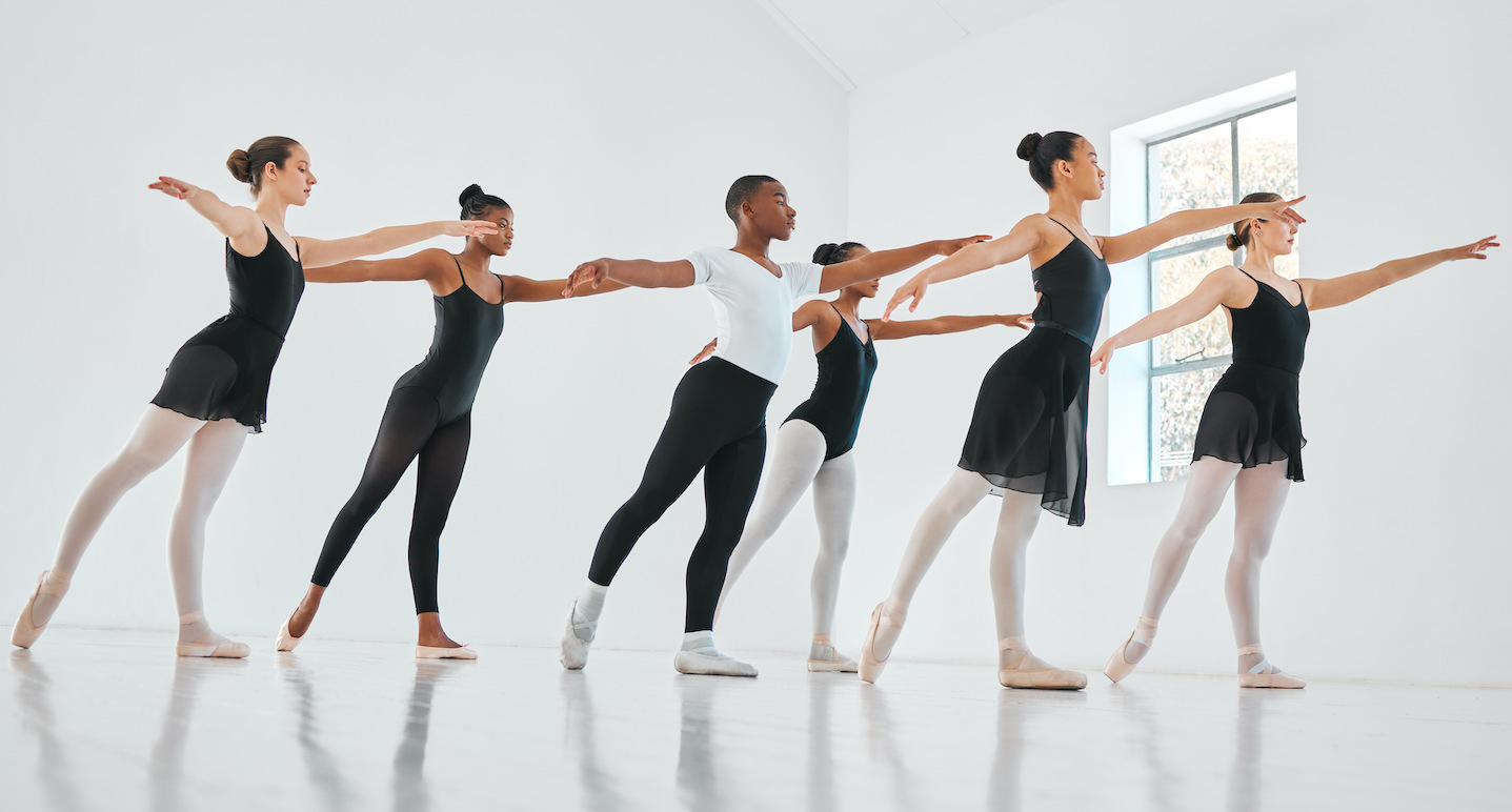 Shot of a group of young ballet dancers practicing their routine in a dance studio.