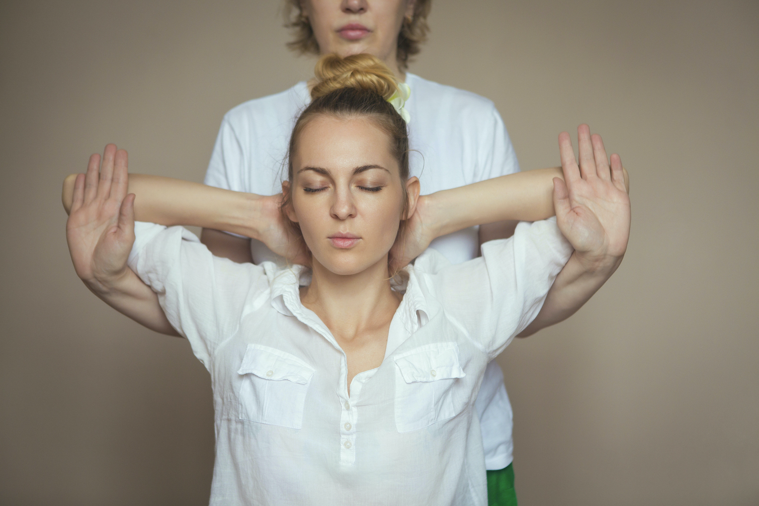 Young woman having massage treatment in health centre.